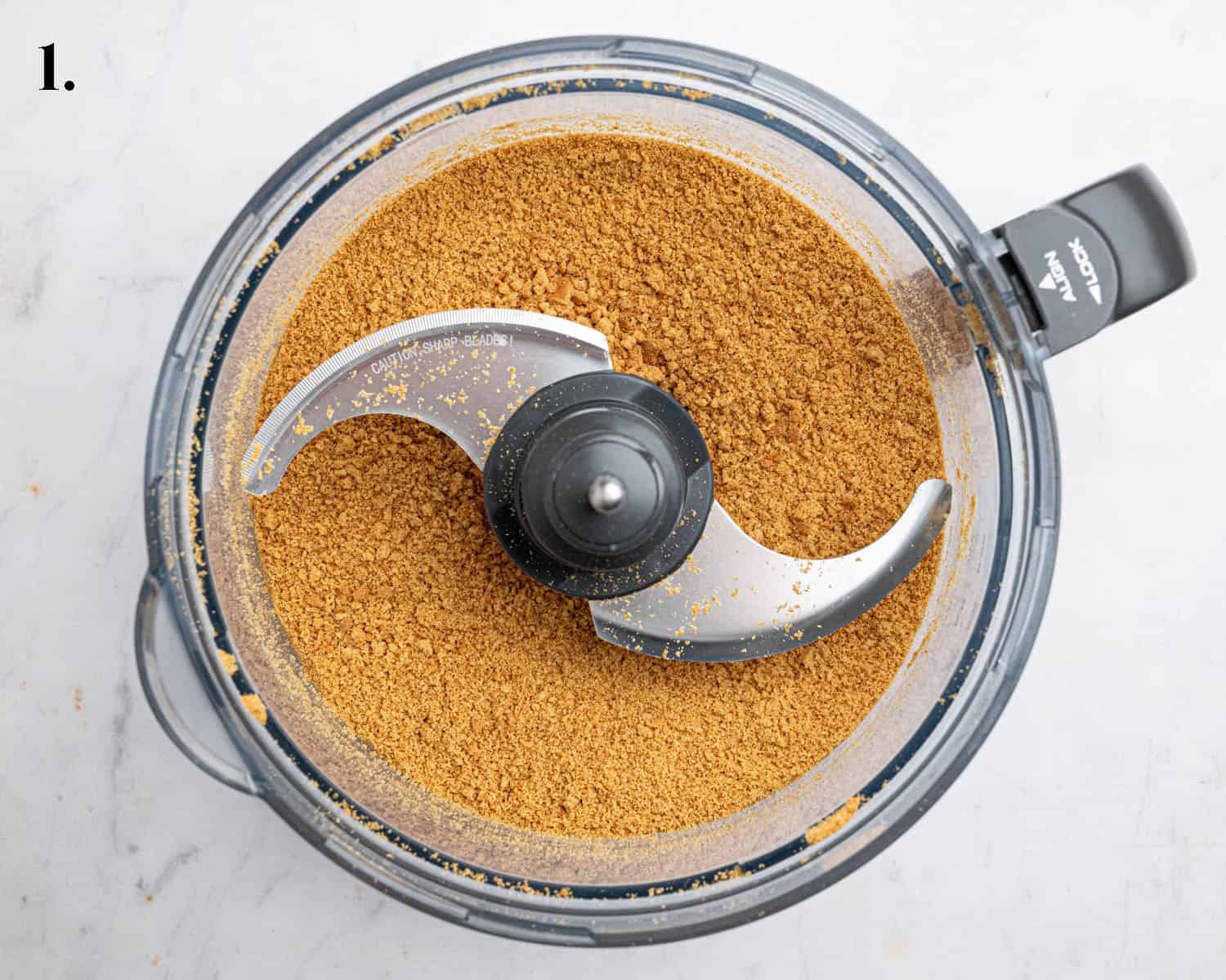 Step 1, the crushed cookies in a food processor.