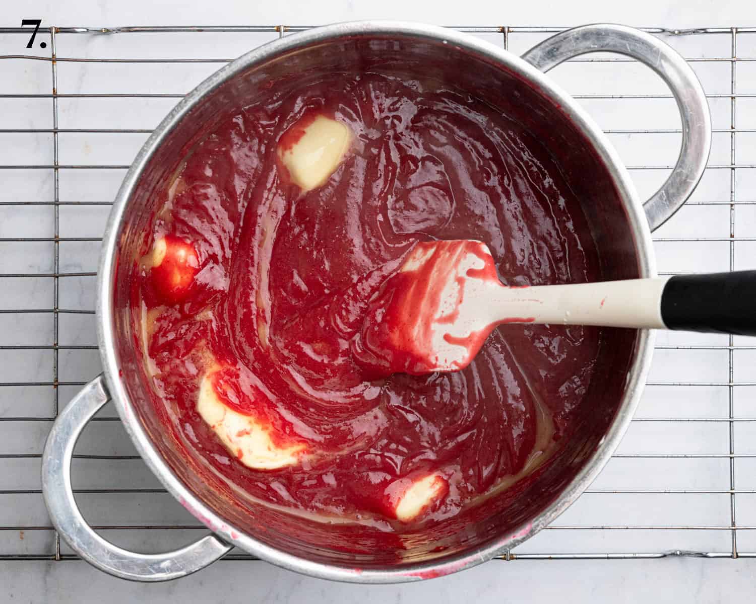 Step 7, adding the butter to the curd.