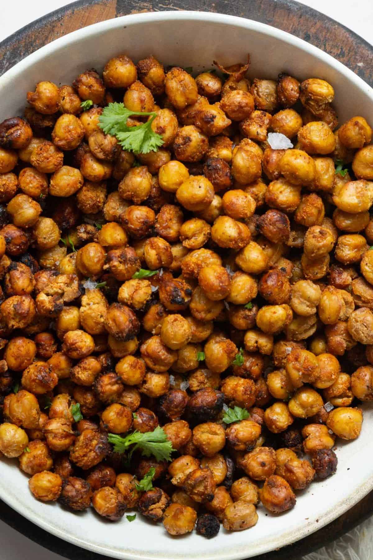 the crispiest air fryer chickpeas in a bowl, golden brown and crunchy