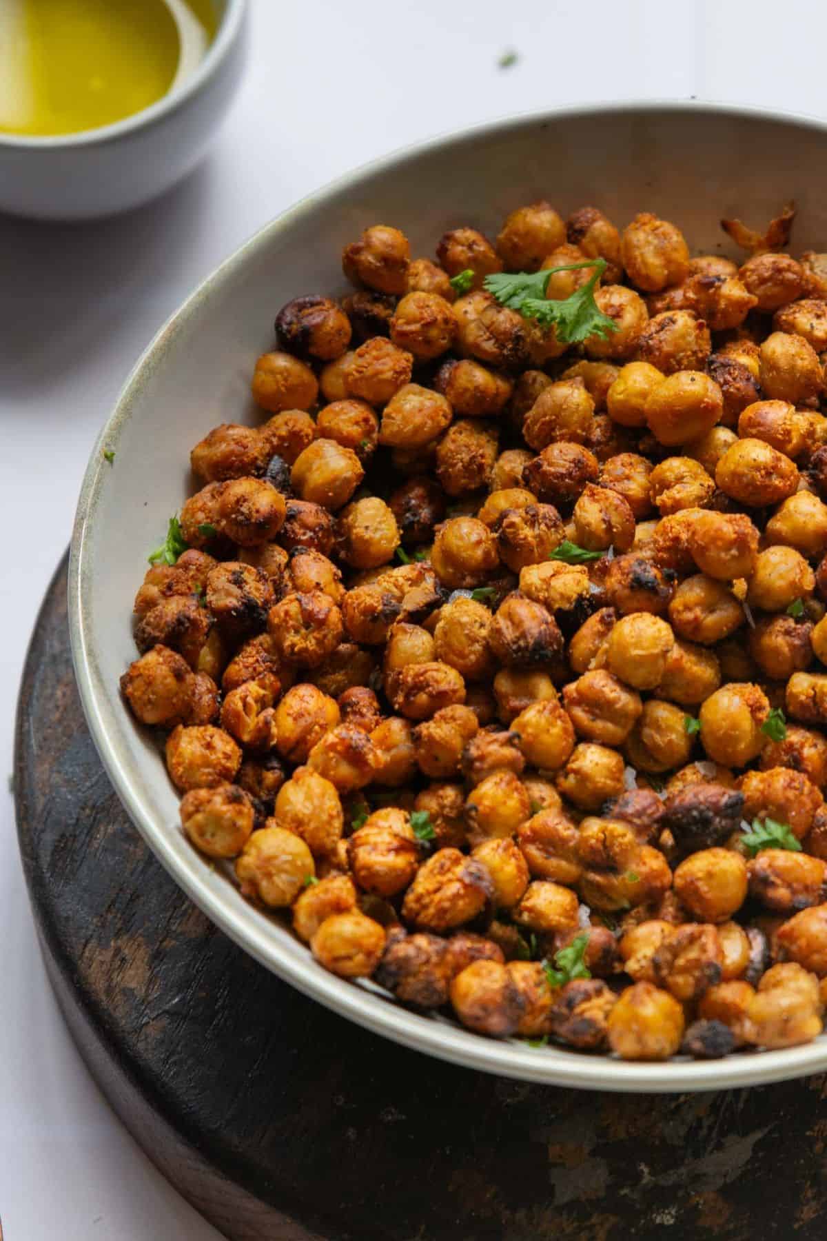 Crispy air fryer chickpeas in a bowl with herbs