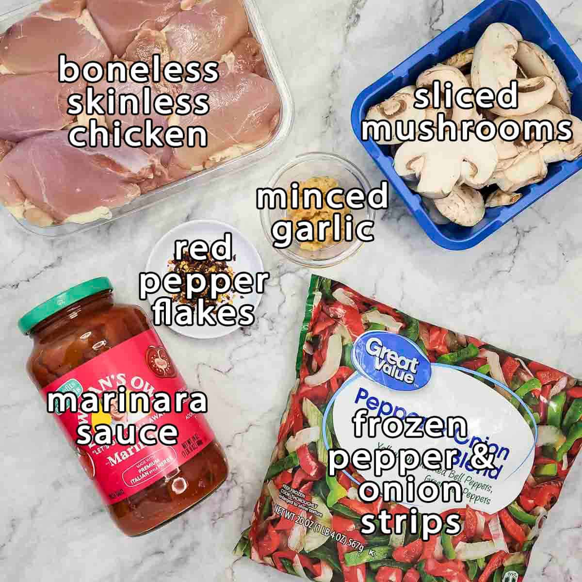 Overhead shot of ingredients - boneless skinless chicken, sliced mushrooms, minced garlic, red pepper flakes, marinara sauce, and frozen pepper and onion strips.