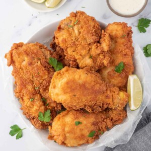 Extra crispy fried chicken on a serving plate.