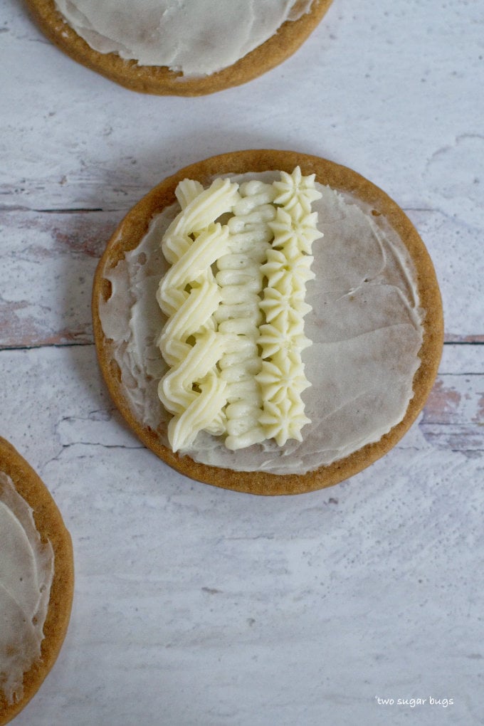 third row of piping on sweater cookie using Wilton 21