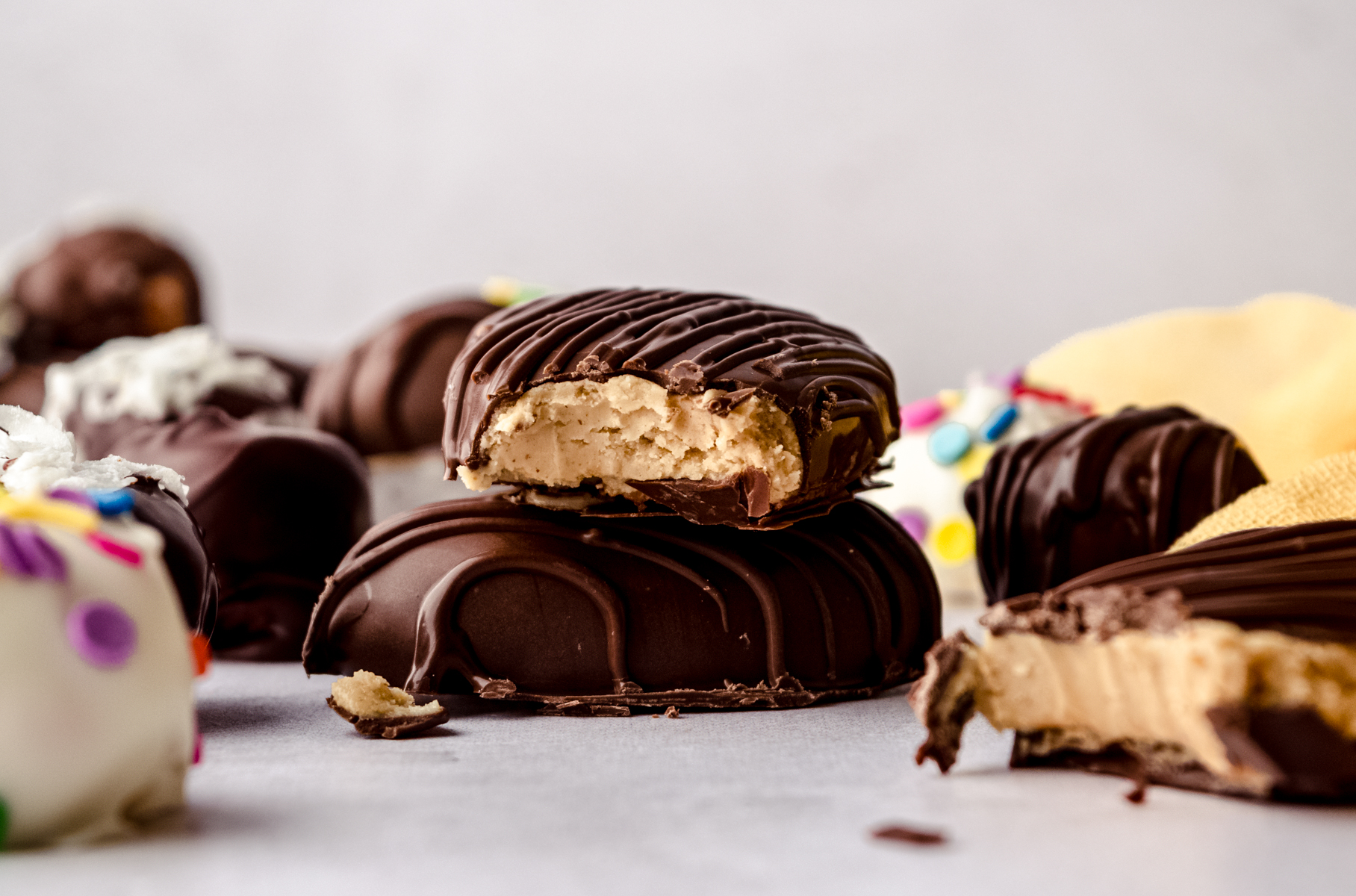 A stack of two peanut butter Easter eggs and a bite has been taken out of the one on the top.