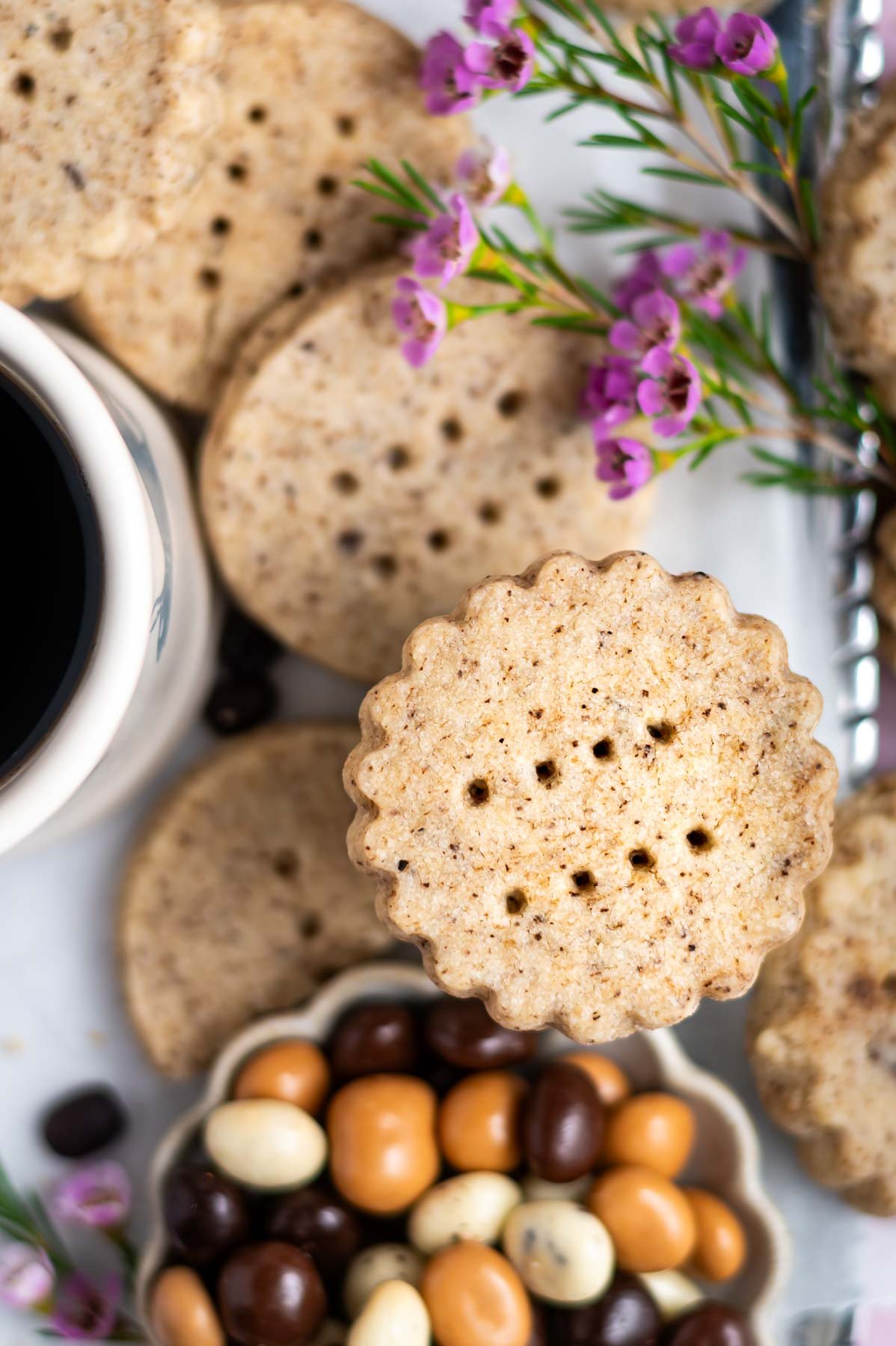 overhead look at shortbread biscuits with a bowl of chocolate covered espresso beans