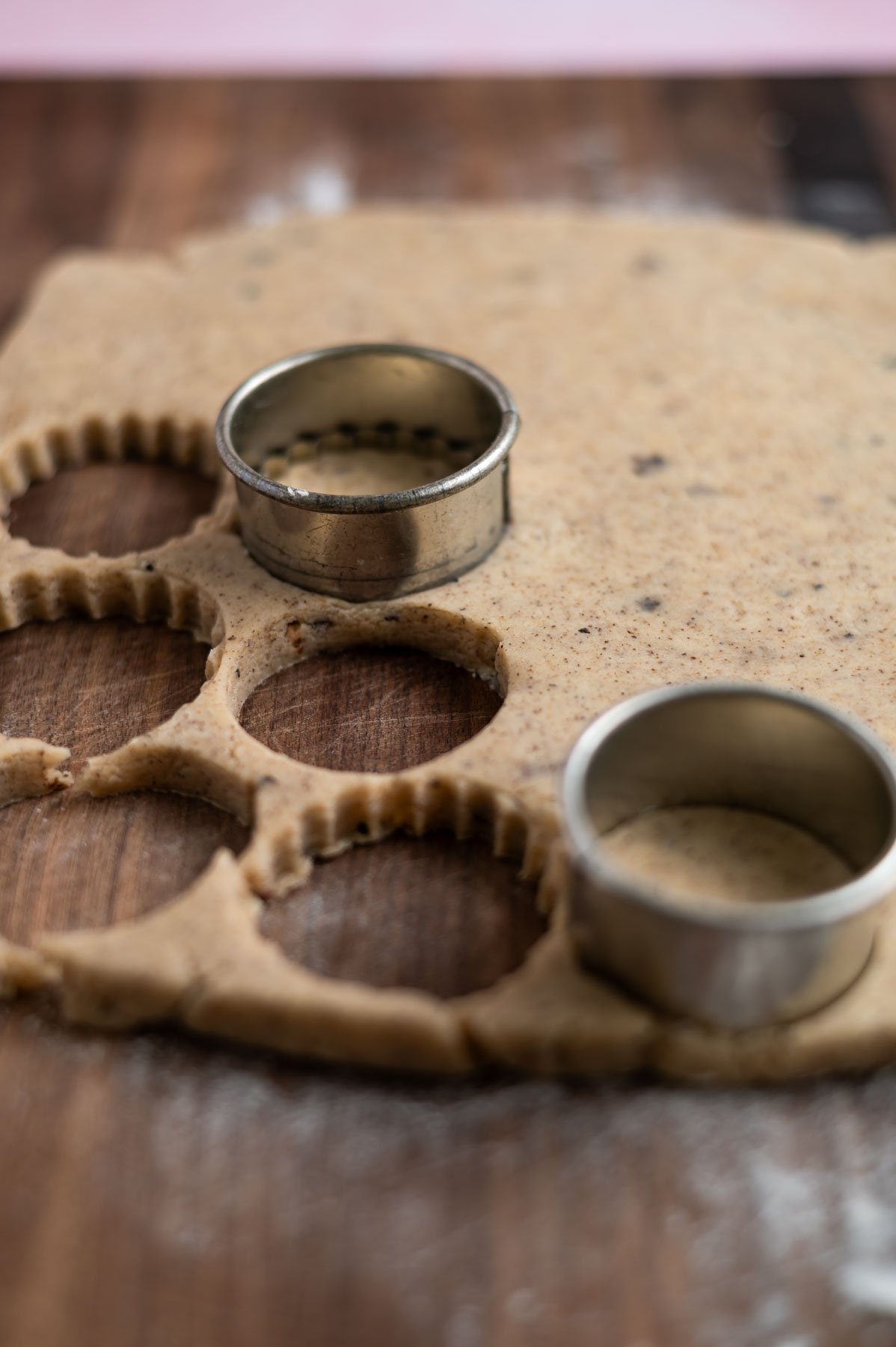 rolled out cookie dough with cookie cutters