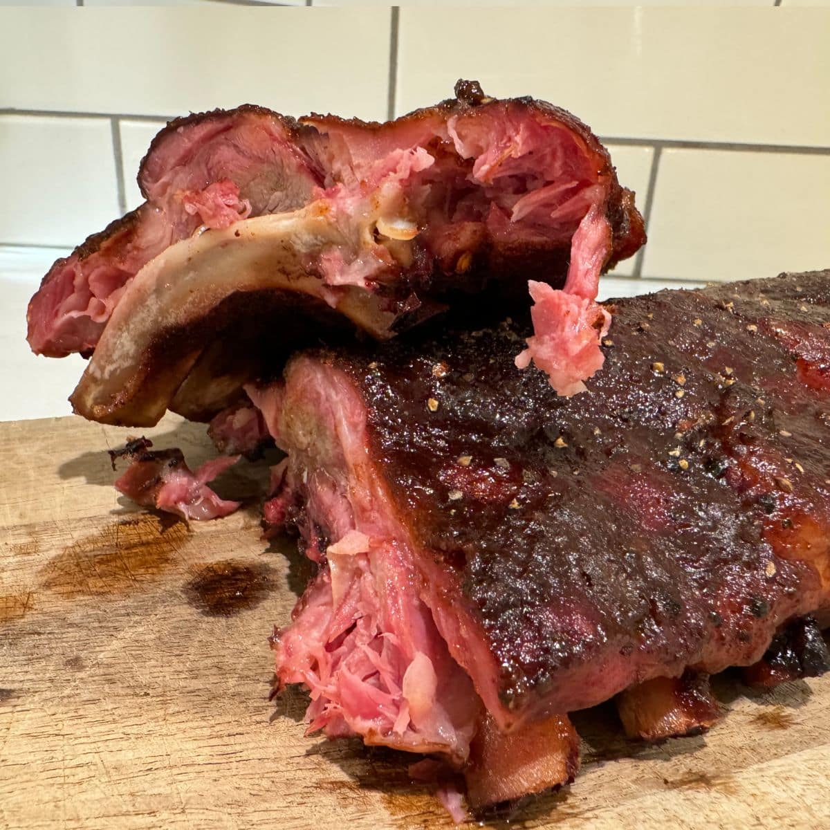 finished smoked ribs cut to show inside