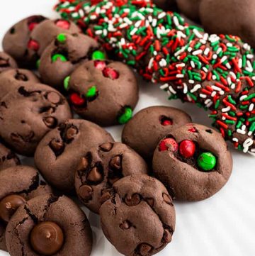 All of the chocolate cake mix cookies on a white plate