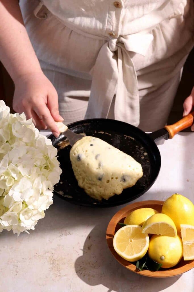 flipping blueberry lemon pancake