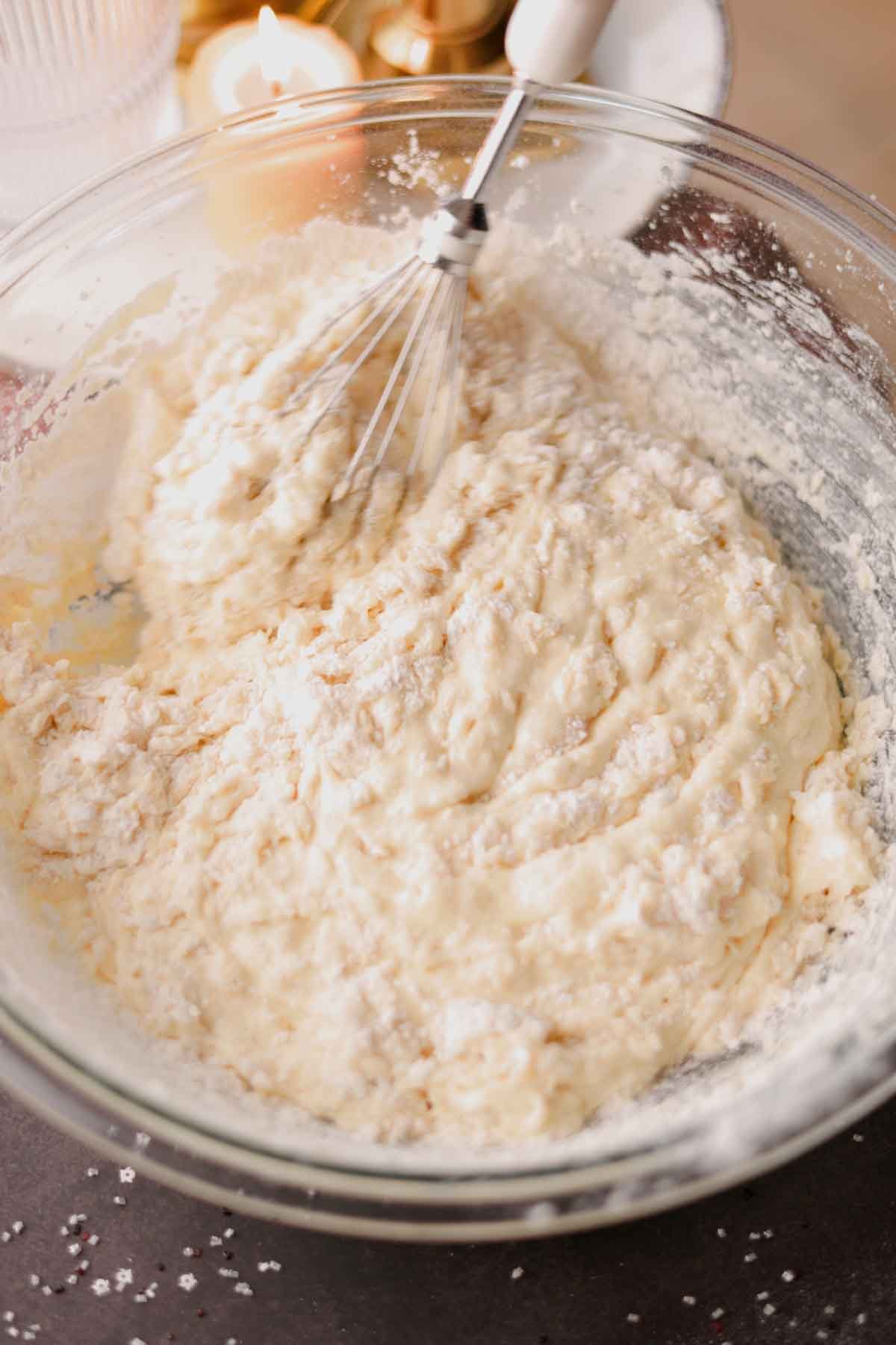 folding flour into cake batter with a whisk