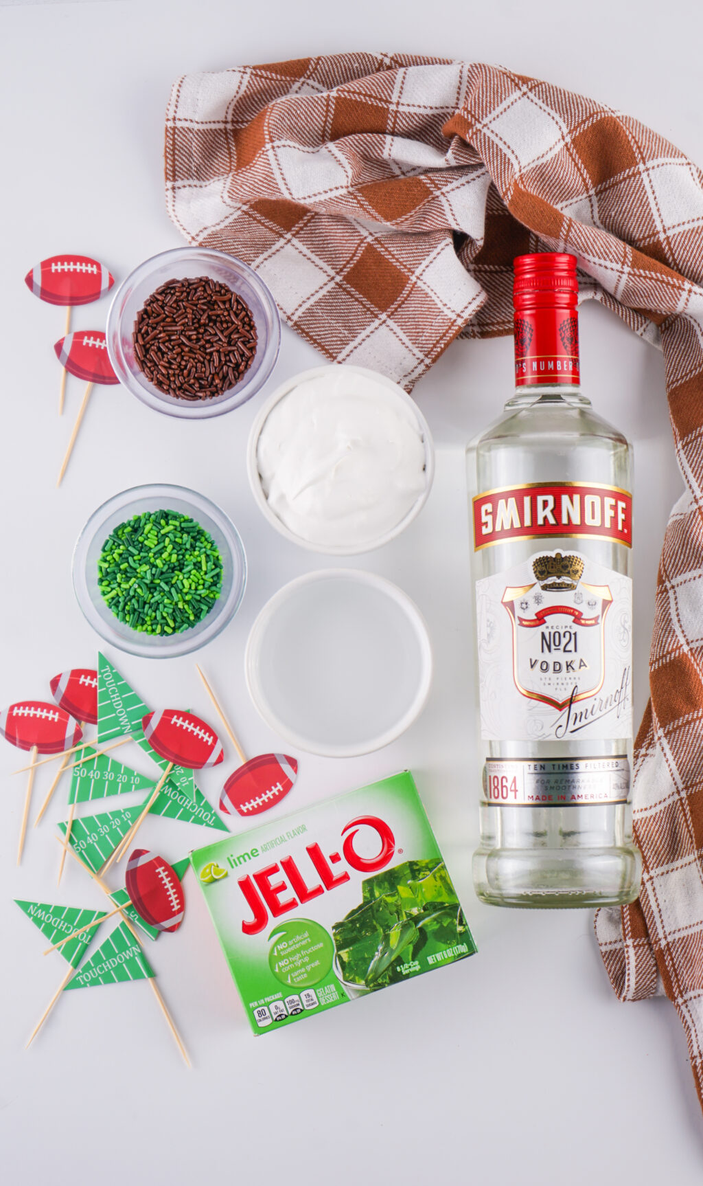 football jello shots ingredients on white table