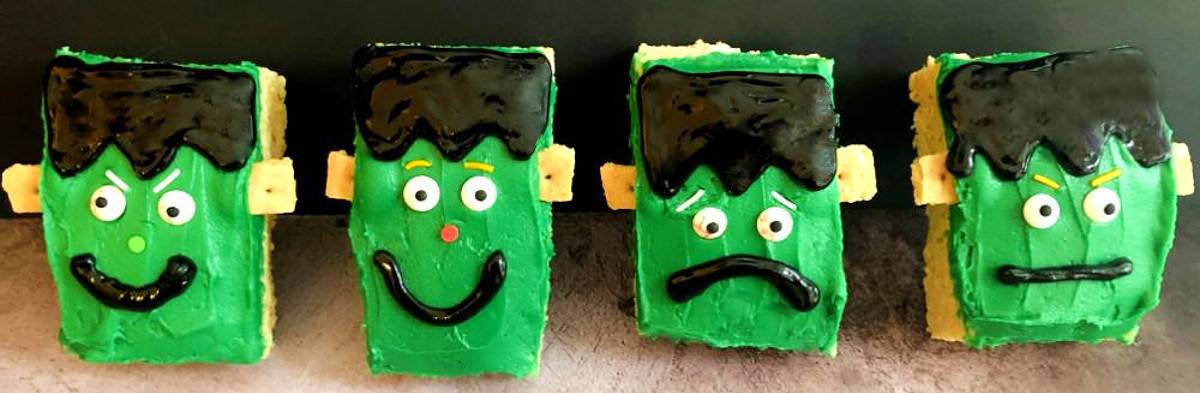 rice kripsie treats with frankenstein faces made out of frosting.