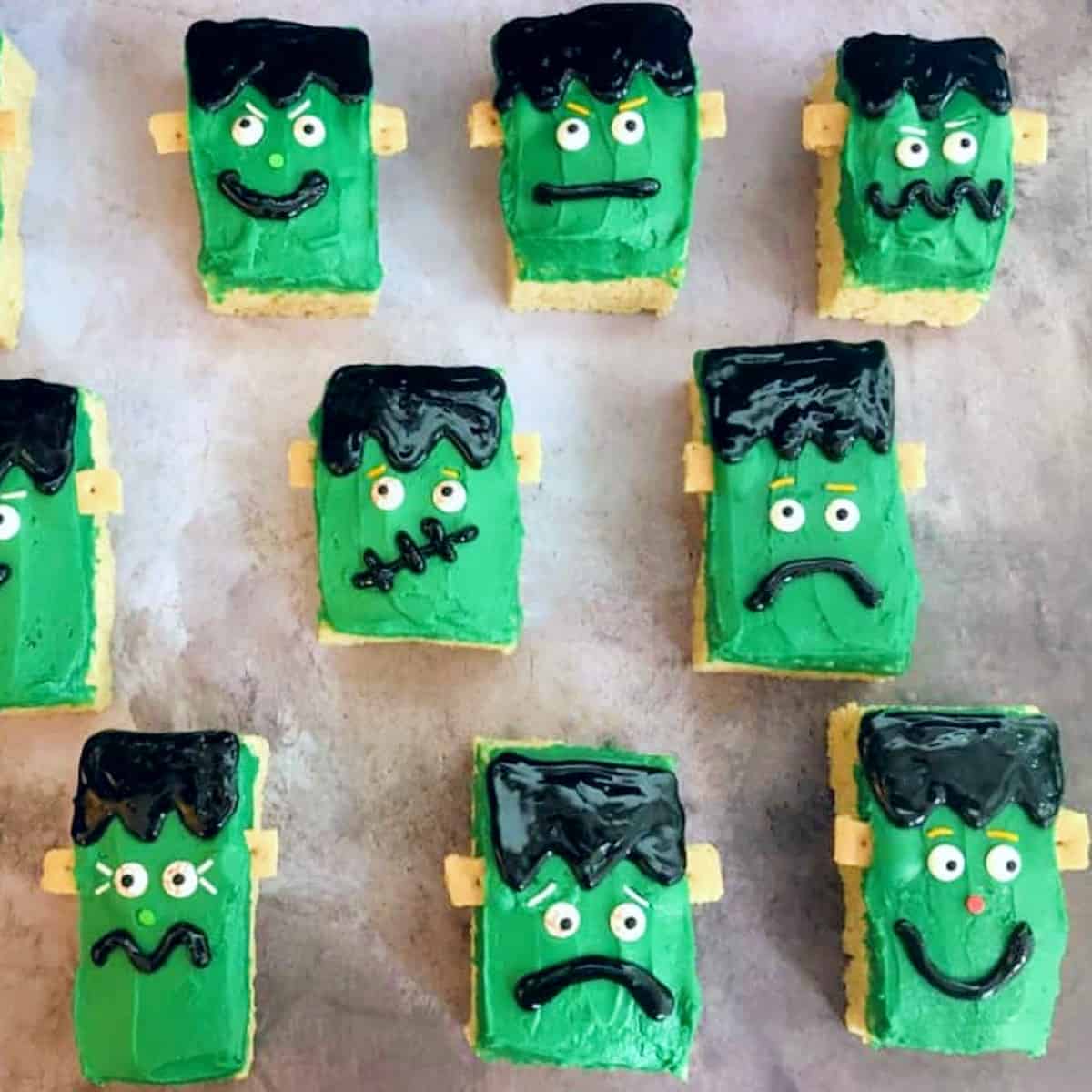 halloween rice krispie treats shaped like frankenstein faces.
