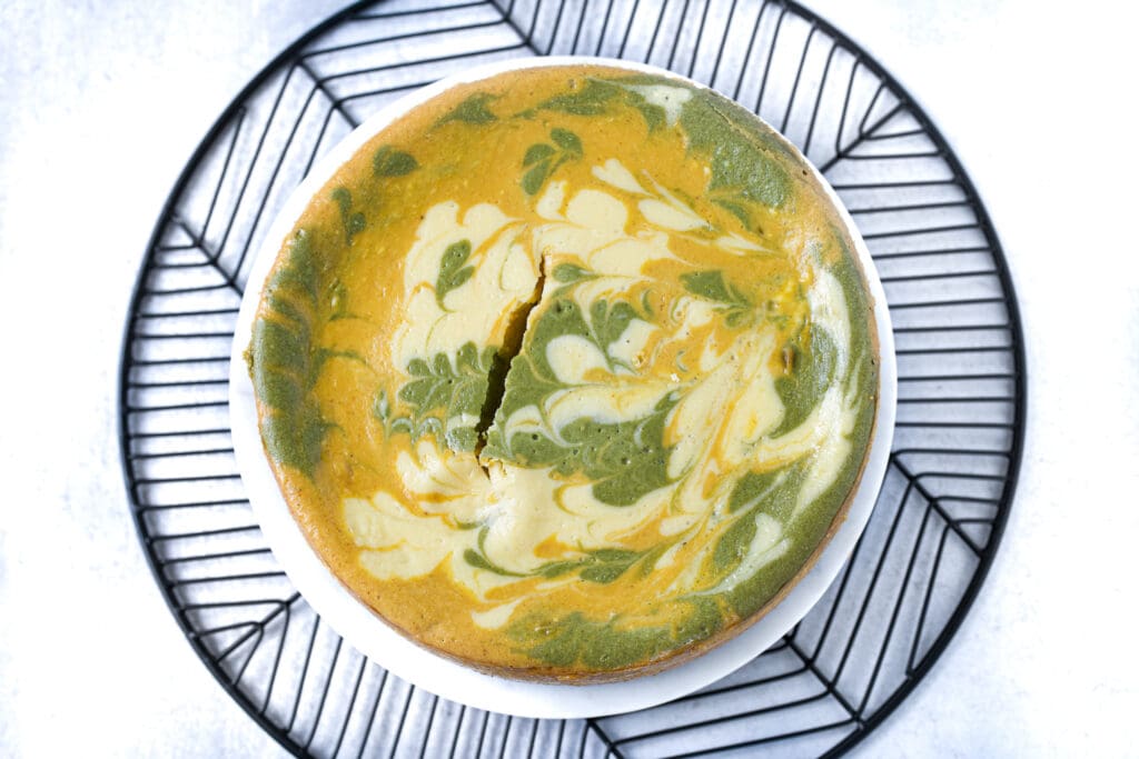 above picture of matcha pumpkin cheesecake on plate