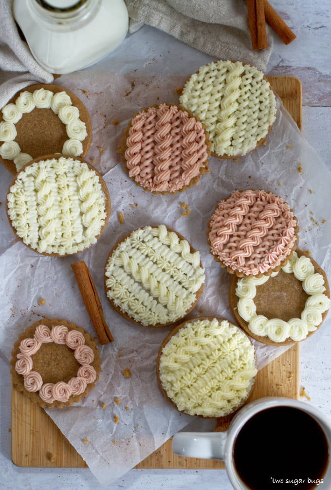 decorated cable knit sweater cookies on parchment paper