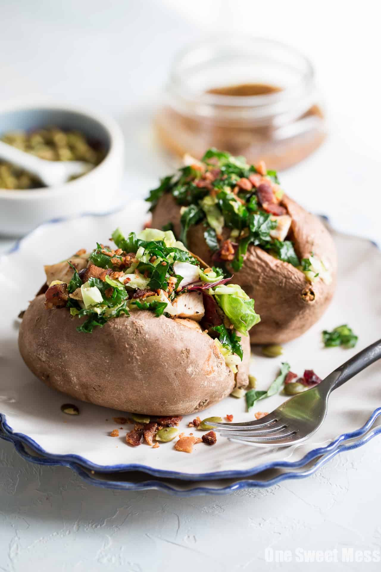 Grilled Chicken & Sweet Kale Salad Stuffed Sweet Potatoes: Loaded with grilled poppy seed dressing glazed chicken and topped with sweet kale salad tossed in warm bacon vinaigrette. Hearty, healthy and gluten-free.