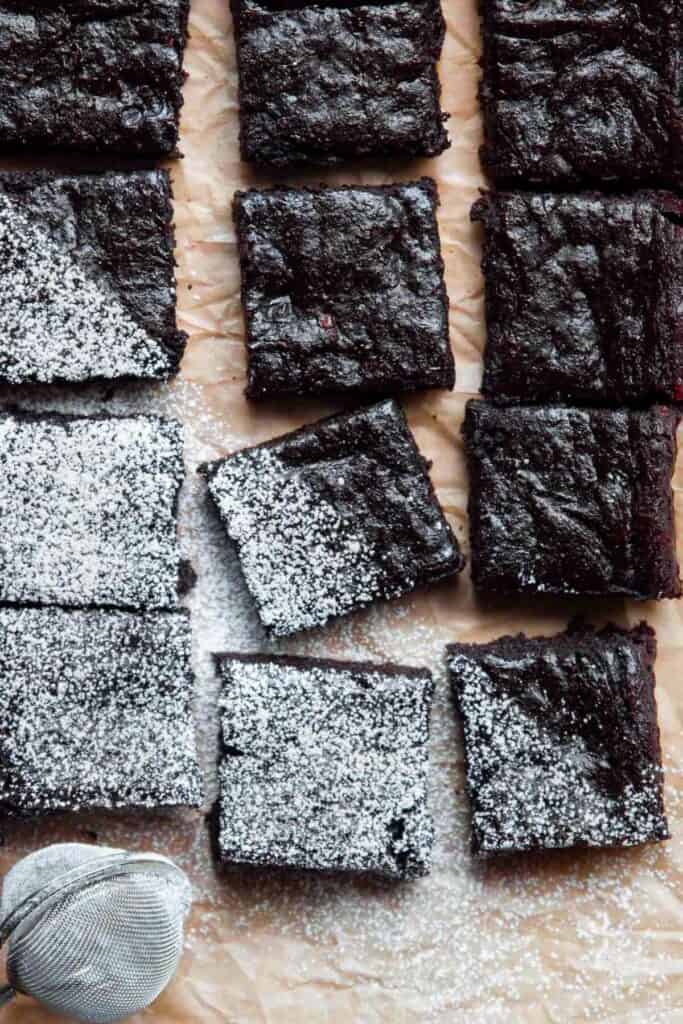 healthy avocado banana brownies with powdered sugar on top