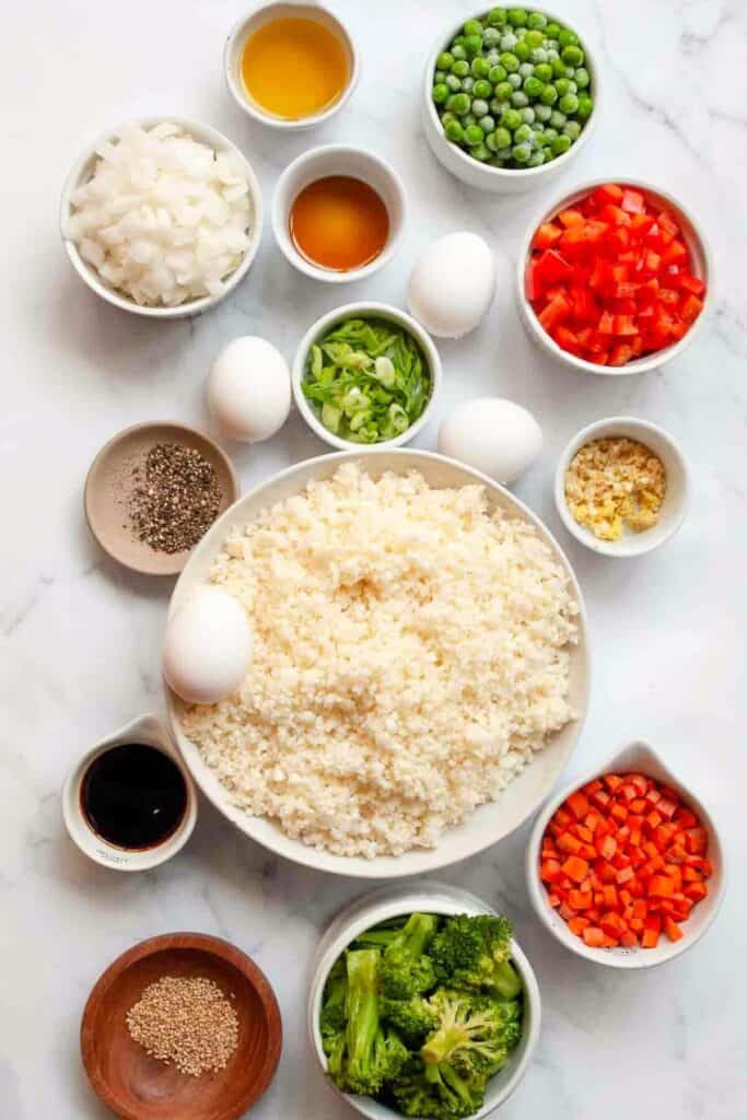 all ingredients in healthy fried rice in small bowls
