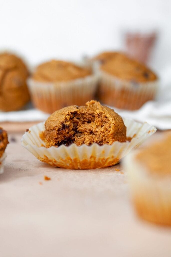 bite shot of a healthy oat flour pumpkin muffin