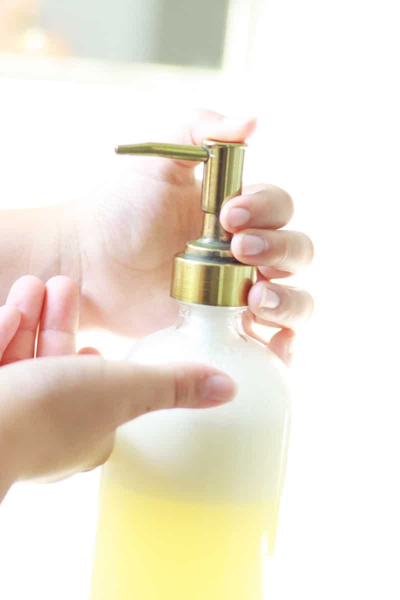 a soap pump bottle of orange face wash