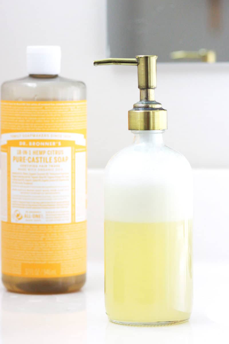a bottle of orange castile soap and a bottle of foaming face soap 