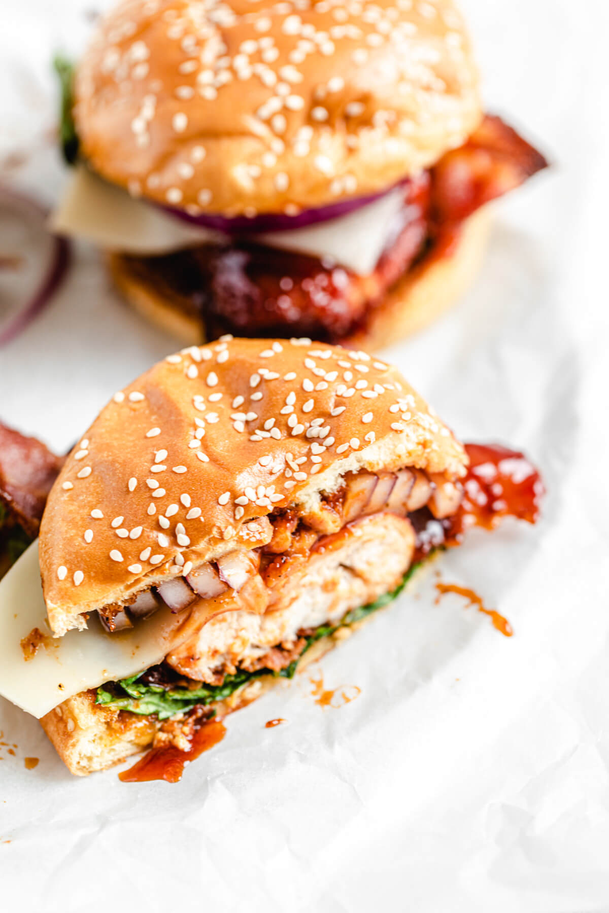 angled top view of chicken sandwich cut in half 
