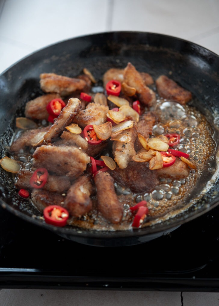 Crispy pork pieces, garlic, and red chili added to thickened sticky glaze

