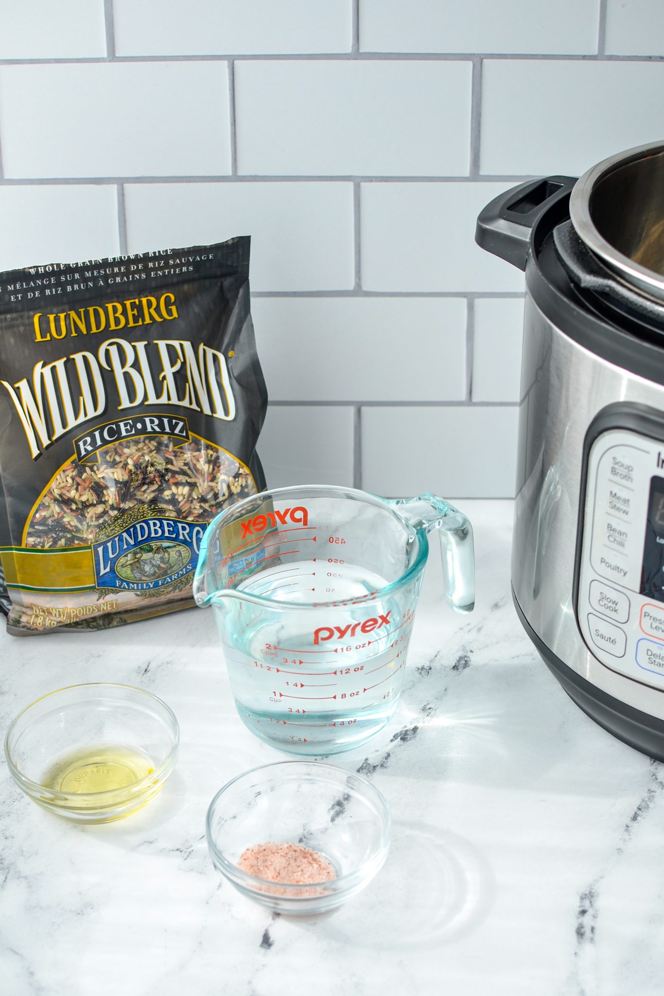 The ingredients needed to make Instant Pot wild rice: rice, water, oil, and salt.