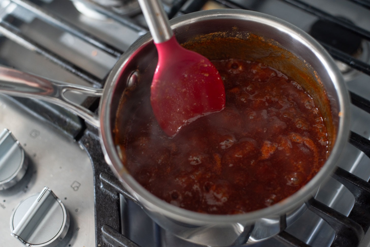 Korean fried chicken glaze simmering in a pot.