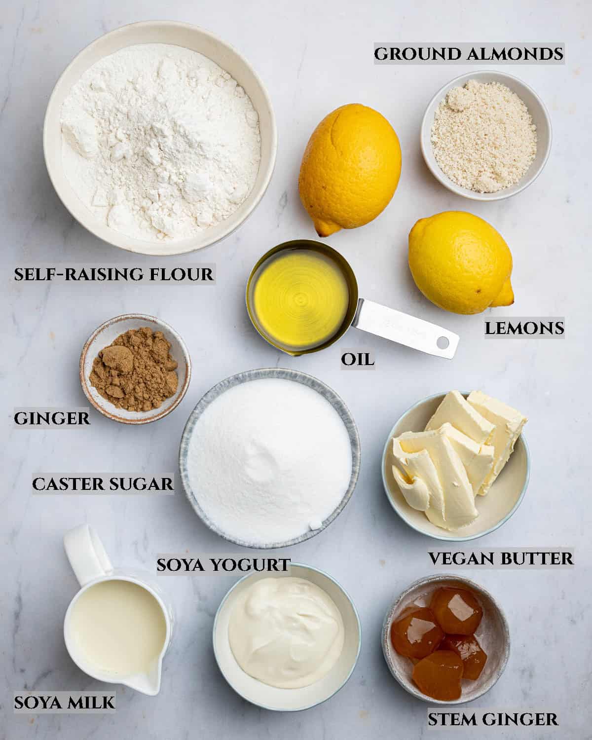 A labelled photo of the ingredients needed to make vegan lemon and ginger drizzle cake.