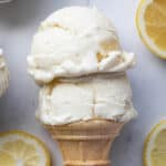 Close up of two scoops of ice cream in a cone.