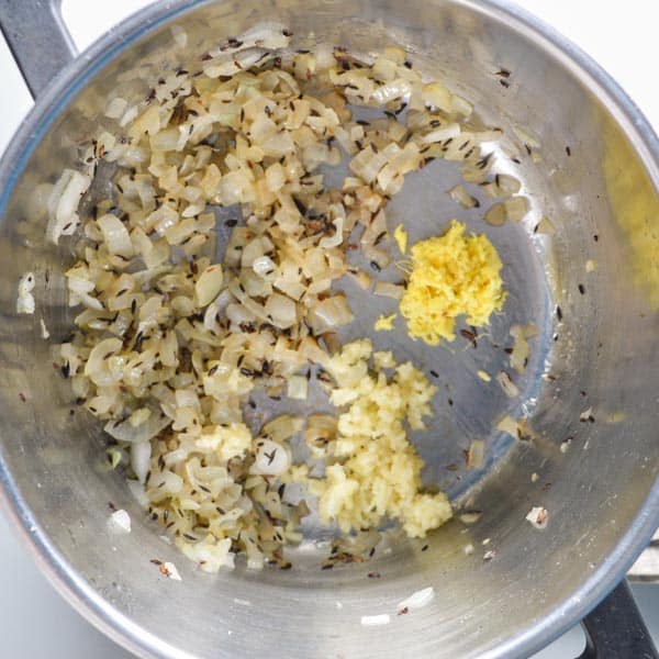 Cooked onions and cumin with raw ginger and garlic