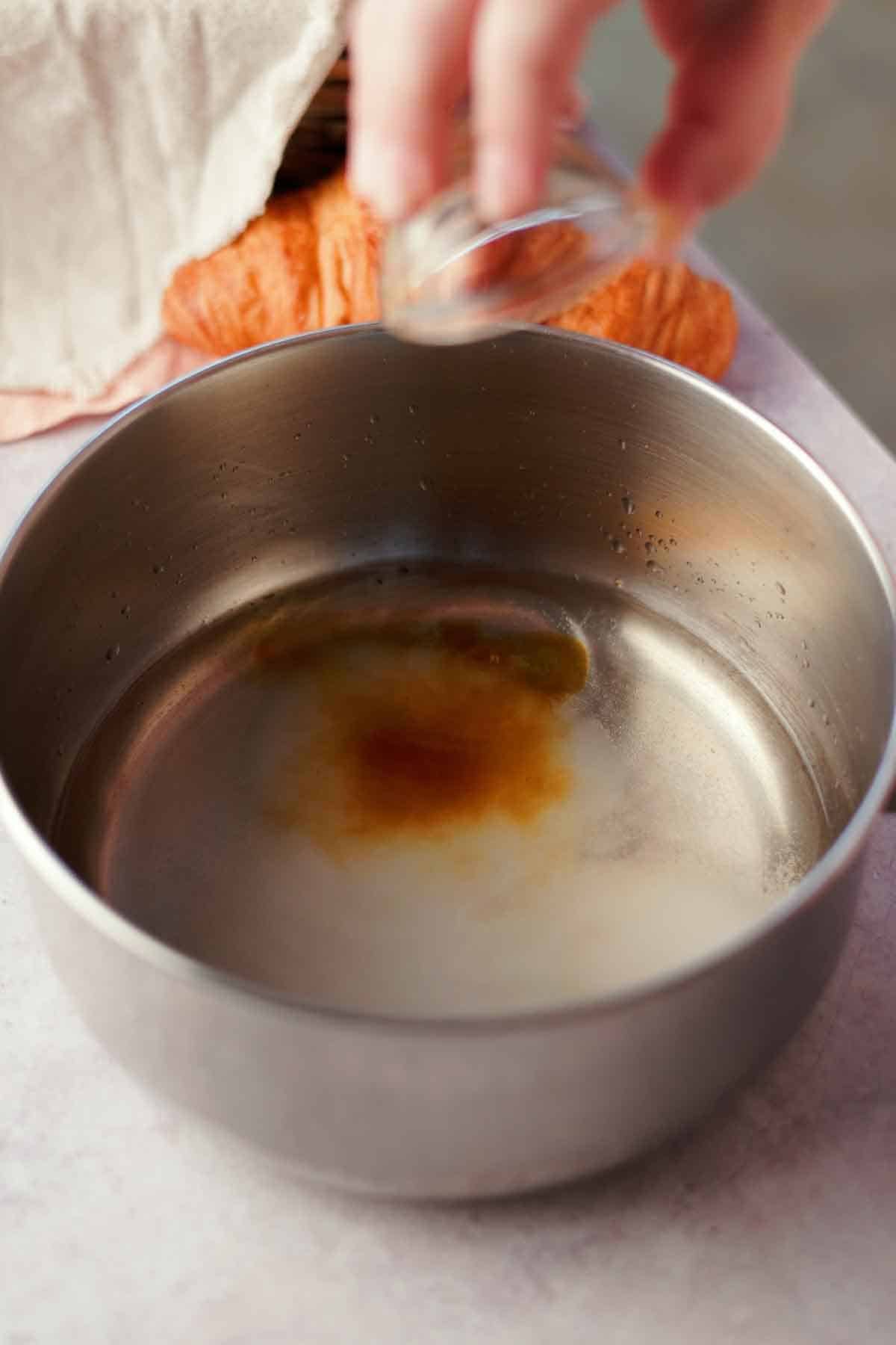 making soaking syrup to rehydrate croissants