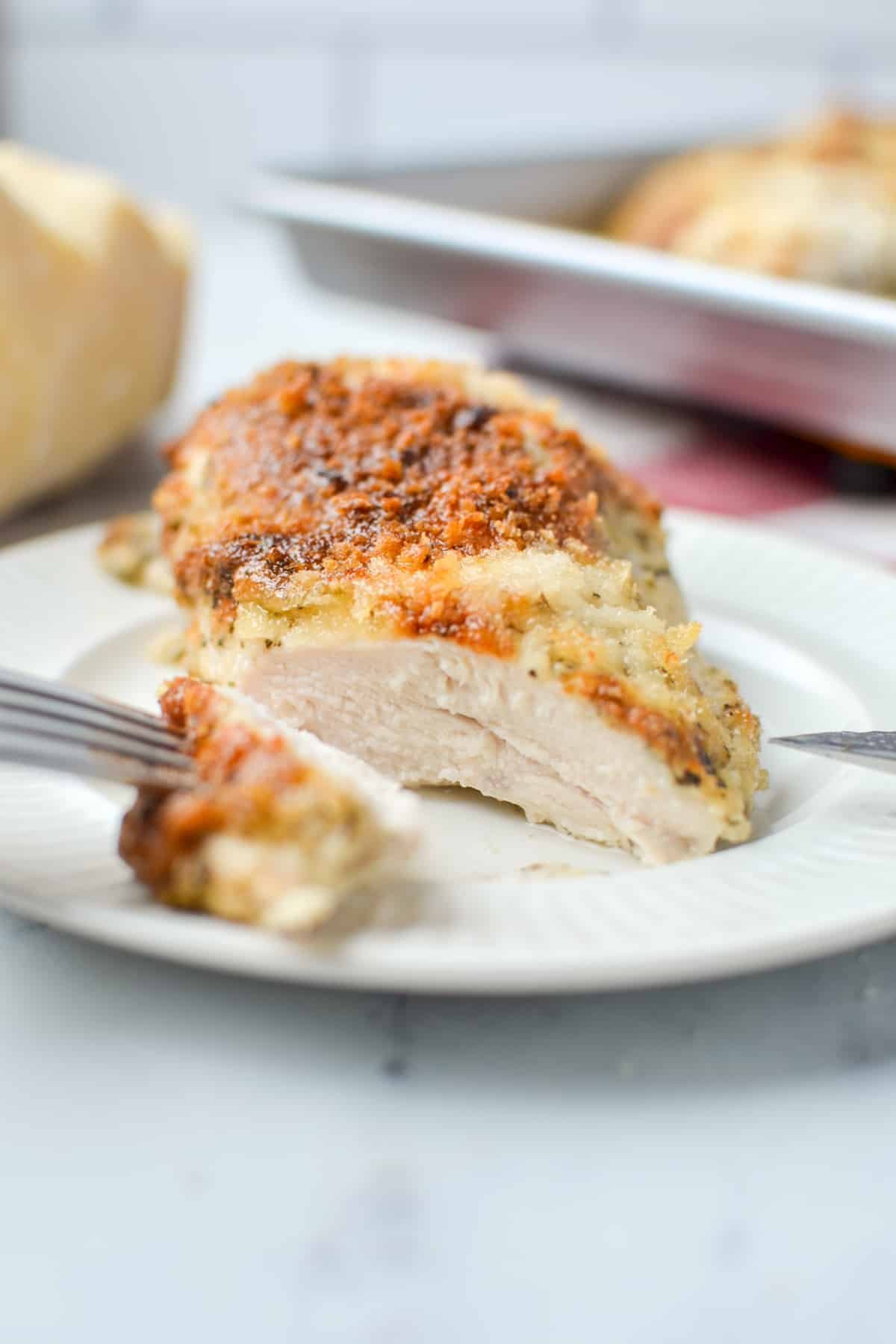 A chicken breast that has been sliced into.