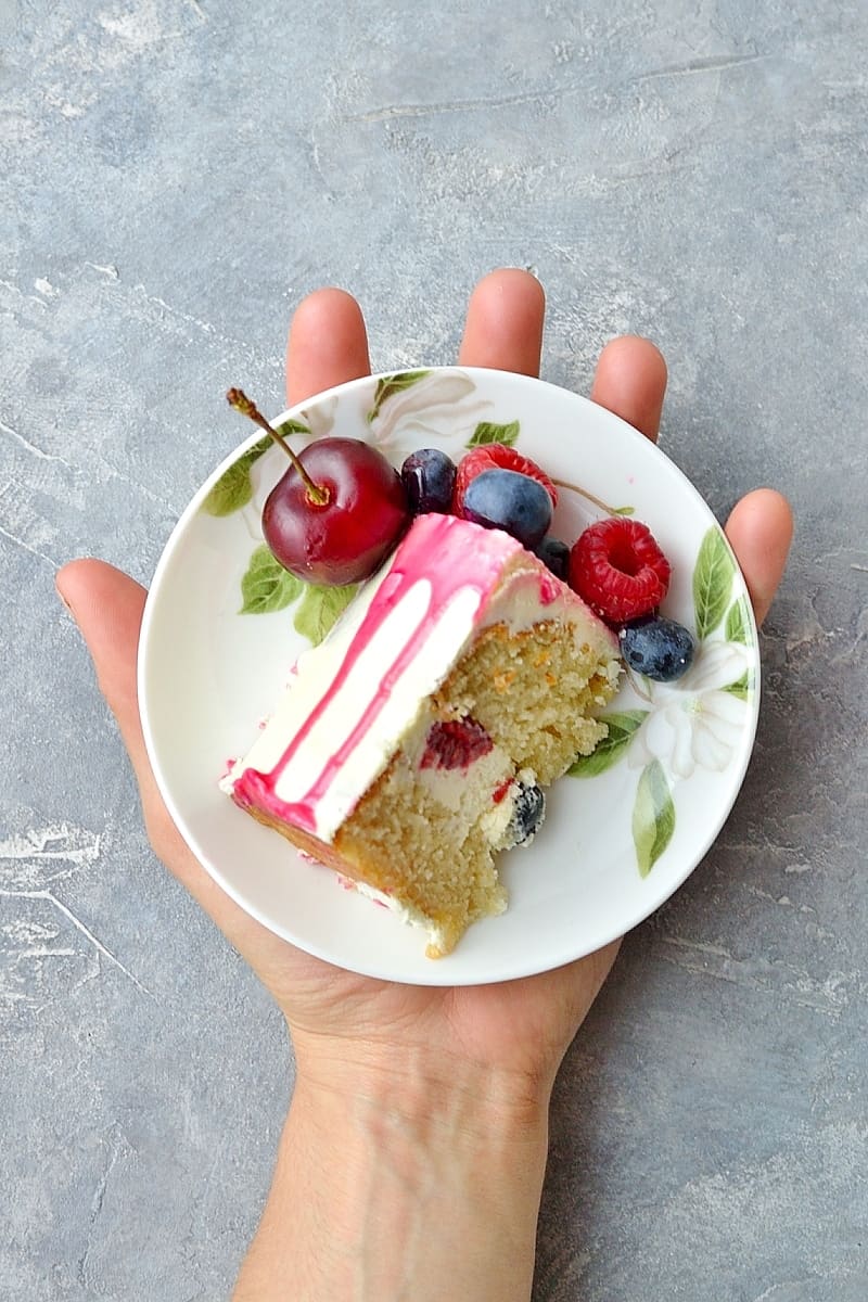 Mini white chocolate berry drip cake - delicious, moist vanilla cake with whipped white chocolate gananche, pink white chocolate drip and fresh berries; serves just 2-4 people!