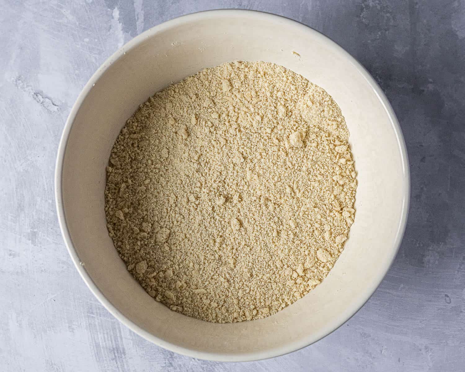 Step 1, rubbing the butter into the flour.