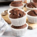 Chocolate Nutella muffins in white paper cases.