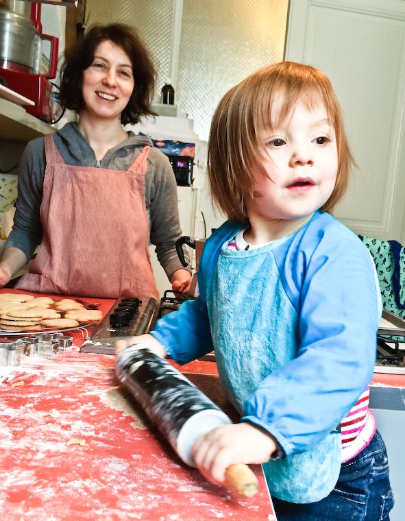 Olivia rolling out the dough for cinnamon cookies