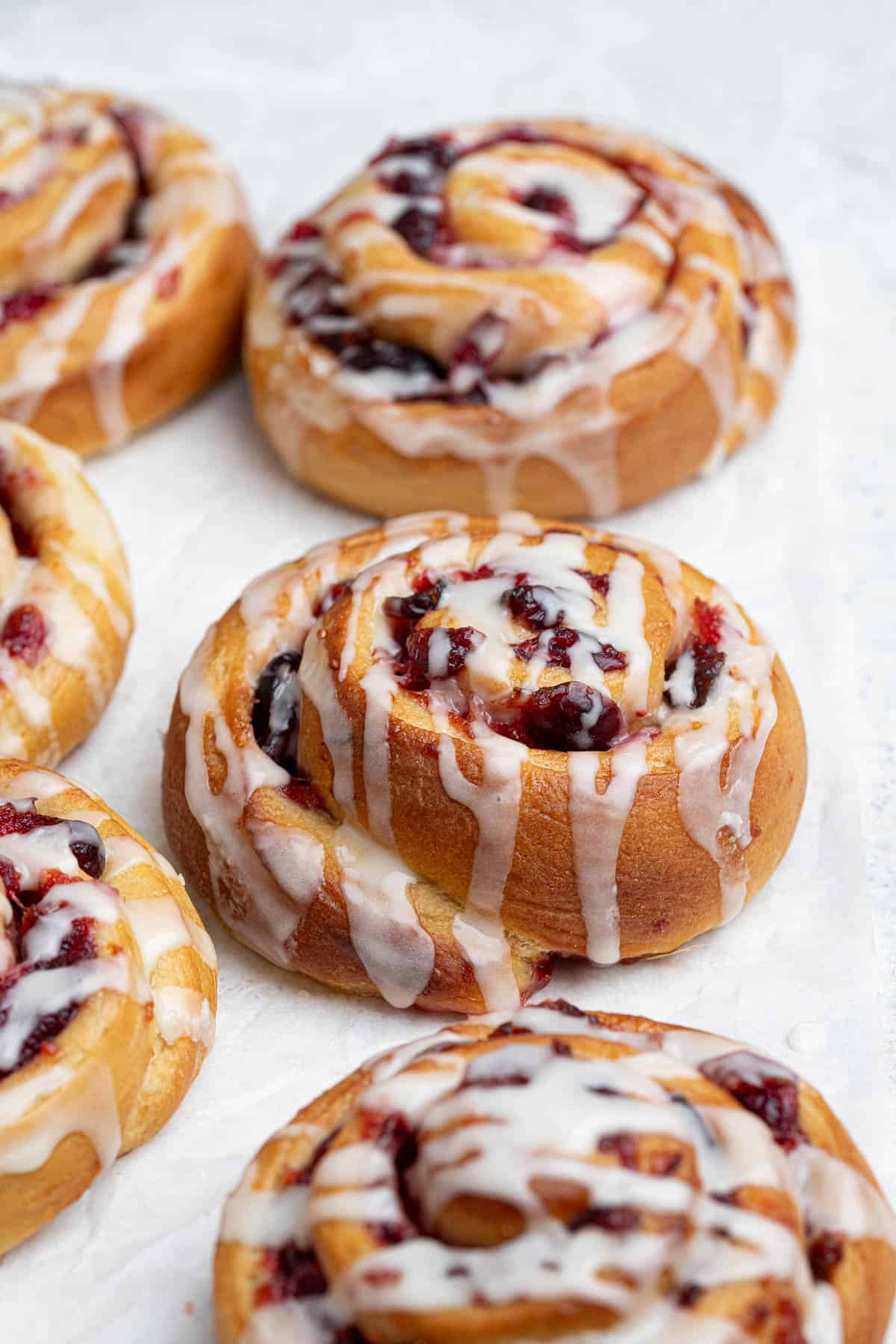 Close up of a vegan cranberry orange roll.