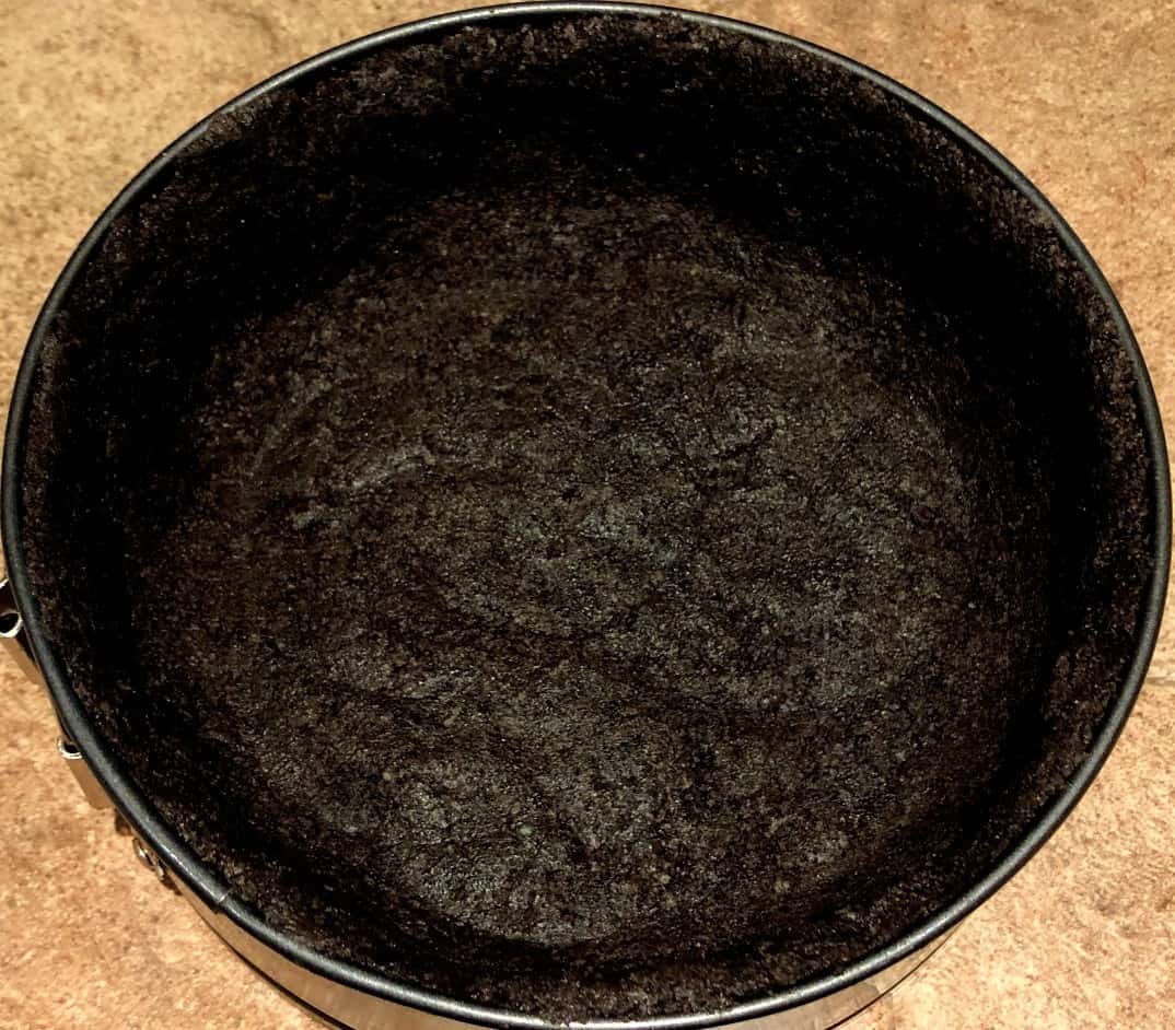 oreo and butter pie crust in a springform pan.