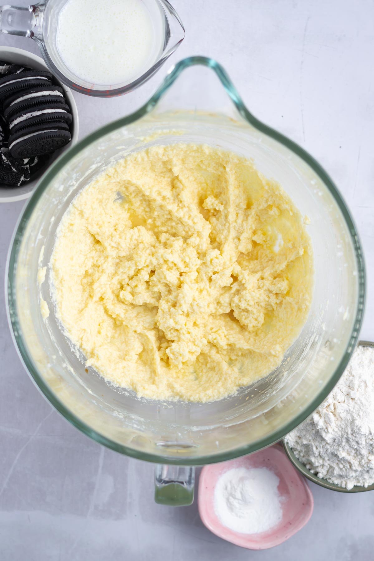 sour cream added to cake batter; which makes it look a little curdled