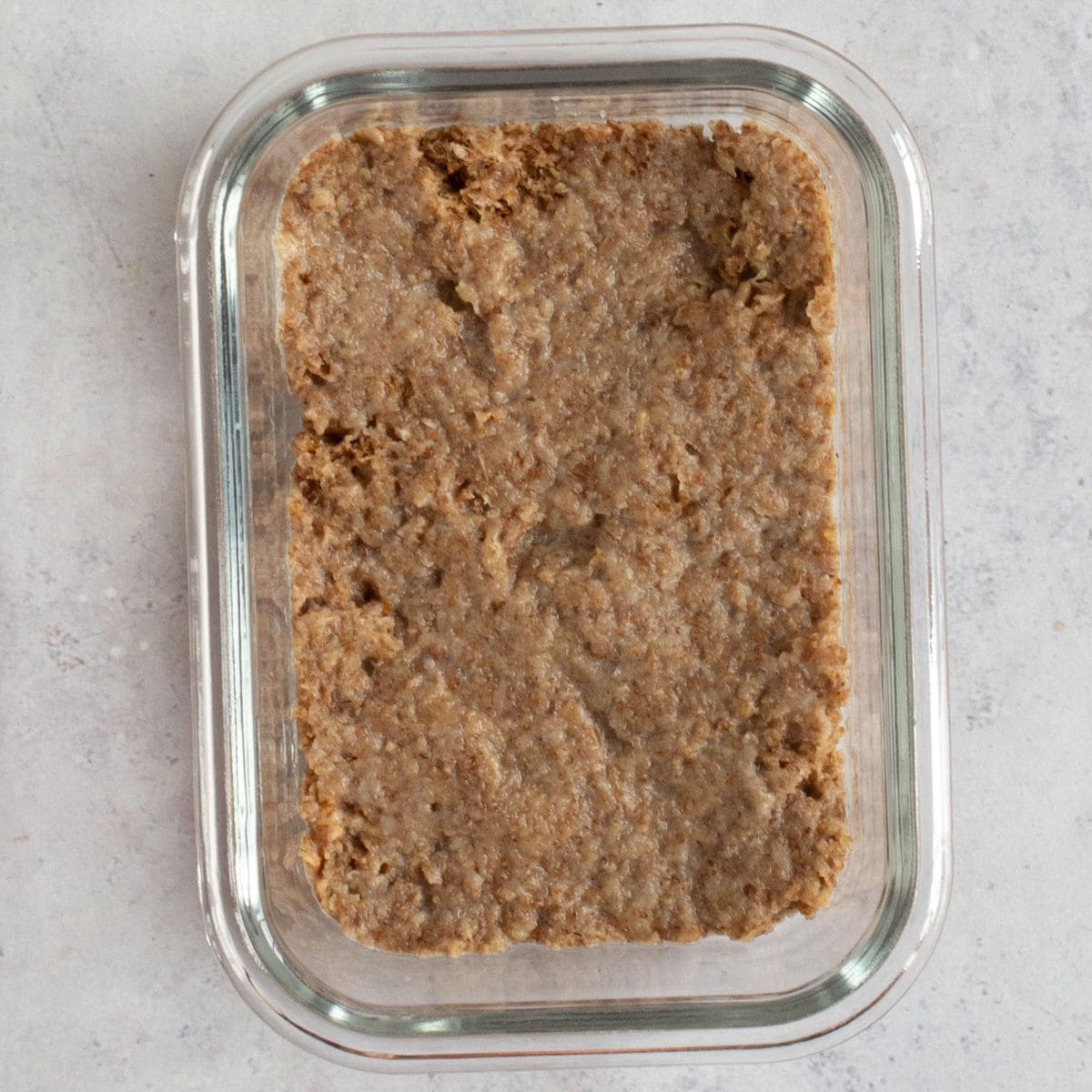 Crushed Weetabix in a glass dish