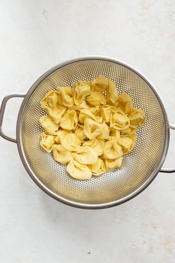 cheese tortellini cooked and drained in a colander