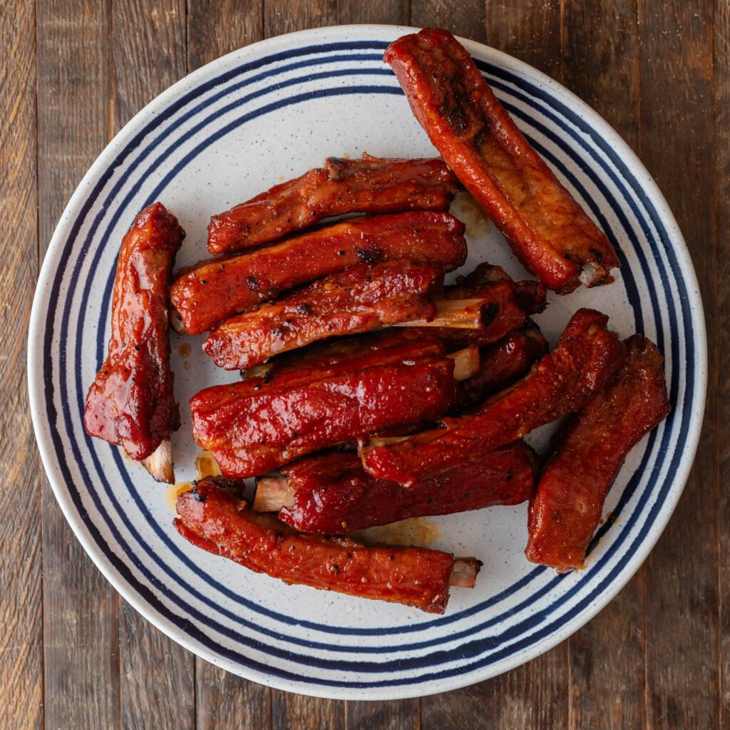 smoked party ribs on a blue and white plate