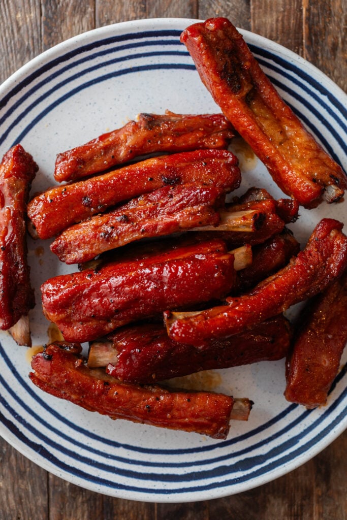 smoked party ribs on a white and blue plate