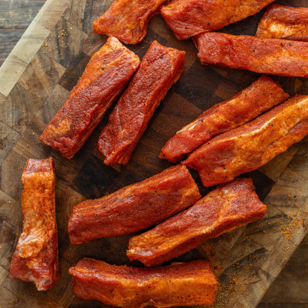 seasoned ribs resting on butcher block