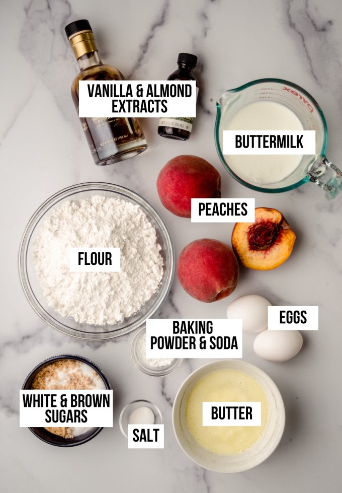 Aerial photo of ingredients to make peach almond streusel muffins with text overlay labeling each ingredient.