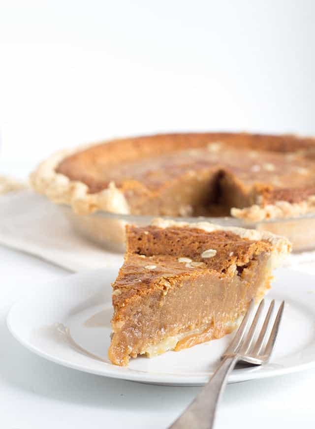 Peanut Butter Fudge Pie - Gooey peanut butter pie that's incredibly decadent and tastes like a mouthful of chewy fudge. This pie is similar to a pecan pie except with peanut butter. You'll want to make this, You can thank me later