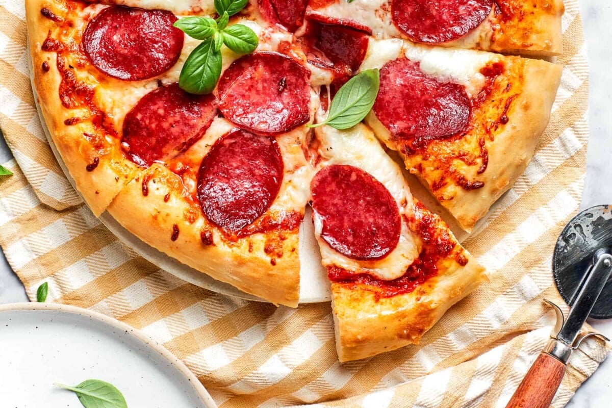 Close-up of crisp, golden-brown pizza crust edge.