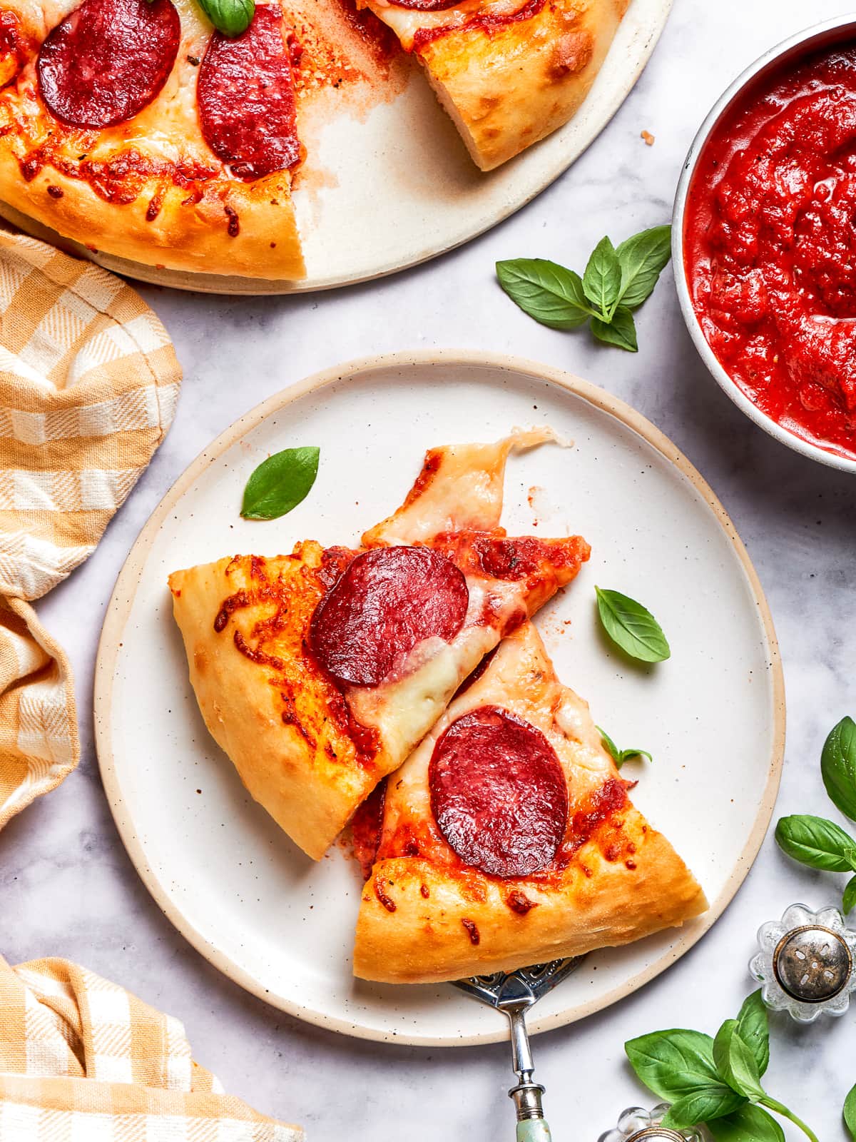 A pair of pizza slices with melted cheese and crispy crusts.